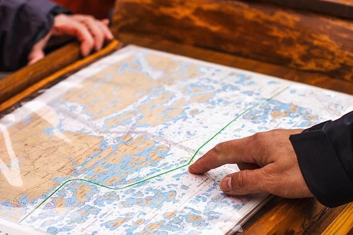 A group of people looking at a map.