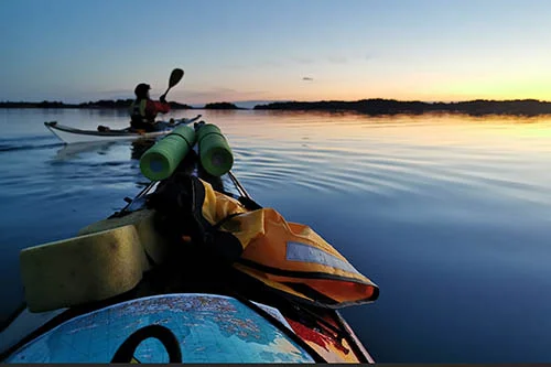 Two kayaks on a sunset on the Archipelago sea